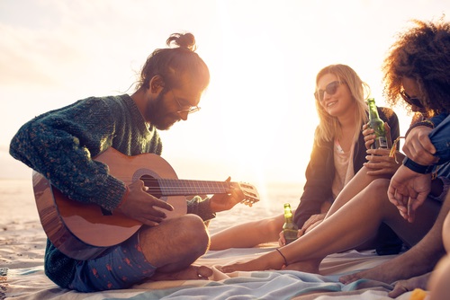 Playing guitar on the beach