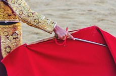 How can tourists visiting Spain help end bullfighting?