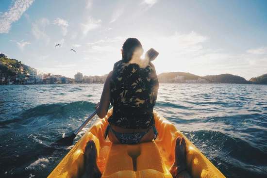woman kayaking on the sea