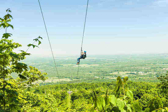 adventurous man zip lining