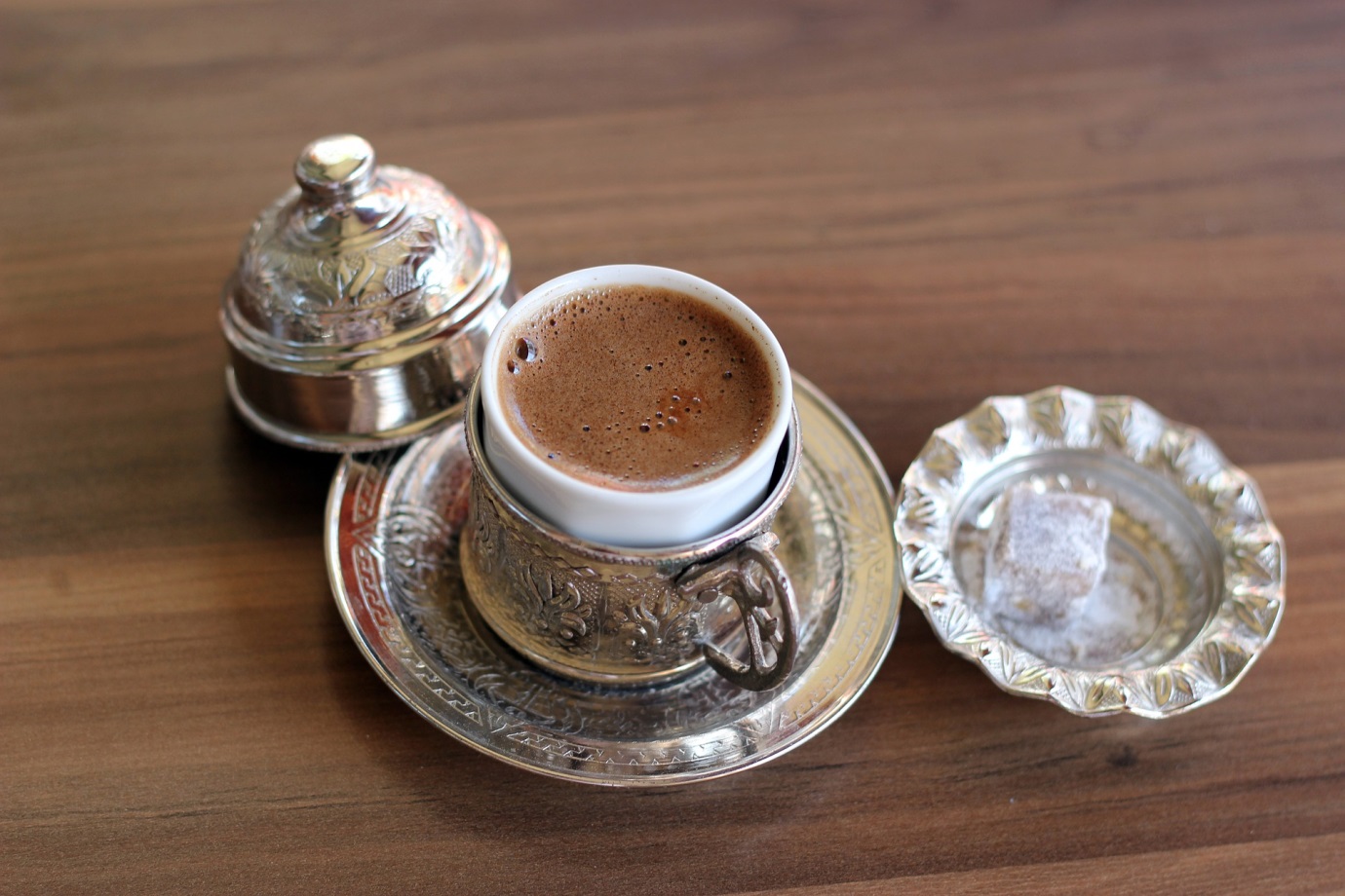 Turkish coffee is made from finely ground beans, and served in copper or brass with a Turkish delight